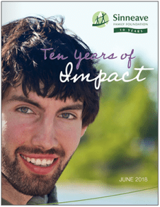 Image of young autistic adult on cover image for Sinneave Ten Years of Impact Report June 2018