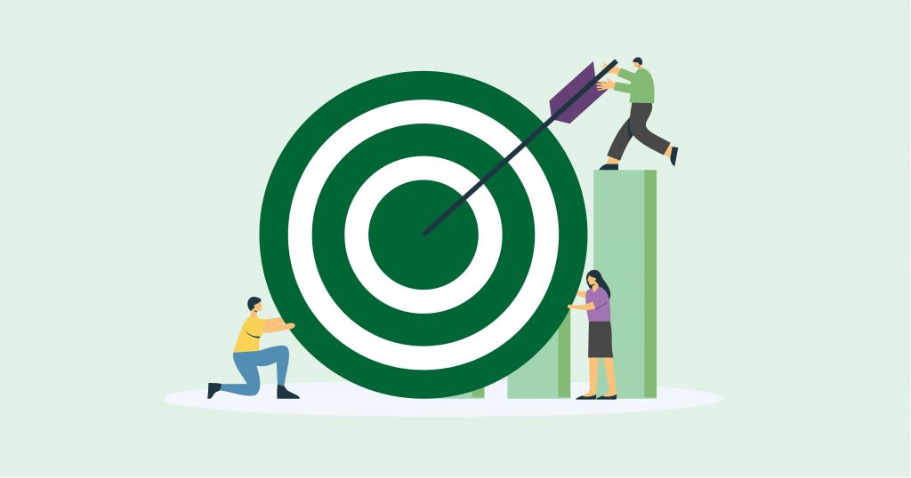 Three cartoon figures interact with a large target. One kneels pushing the target, another stands pushing an arrow into the bullseye, and a third supports the target. They are working together to achieve their goals.