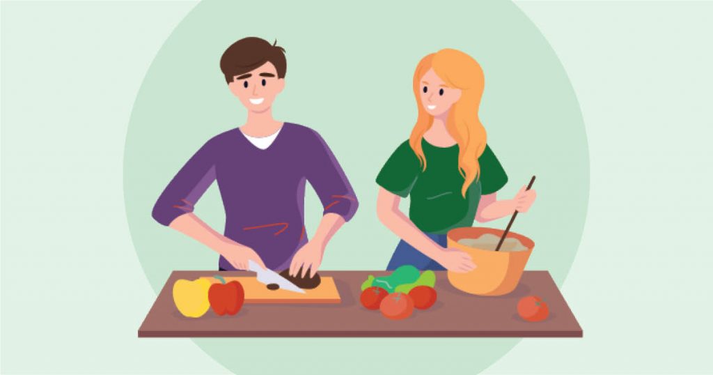Two people cooking together, one chopping vegetables and the other stirring a bowl, with various vegetables on the table.