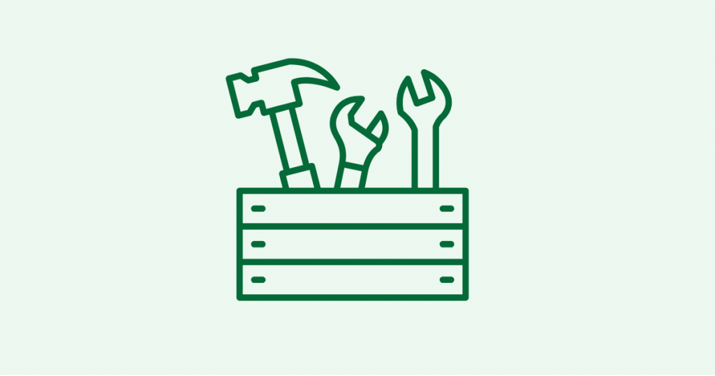 An icon of a wooden toolbox with a hammer and two wrenches sticking out.